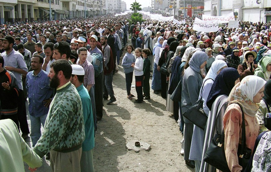 An estimated half a million fundamentalists, men and women in separate columns, demonstrate in Casablanca, Morocco, over a government plan to reform women's status, Sunday, March 12, 2000. The pl ...