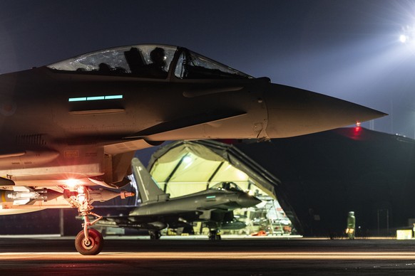 In this British Ministry of Defense photo, a Royal Air Force Typhoon aircraft prepares to take off with others to launch further attacks on Houthi targets in Yemen, Sa...