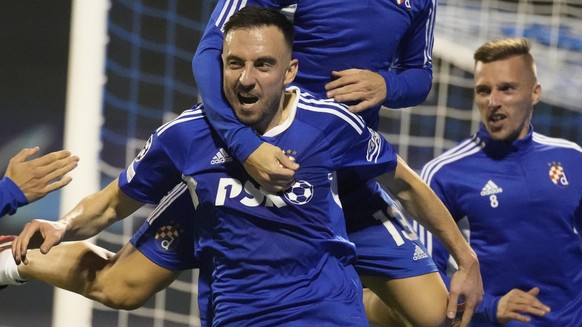 Dinamo&#039;s Josip Drmic celebrates with his teammates after scoring his side&#039;s third goal during the Champions League play-off soccer match, second leg, between Dinamo Zagreb and FK Bodo/Glimt  ...