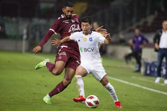 Servette&#039;s forward Ronny Rodelin, left, fights for the ball with Lausanne&#039;s midfielder Toichi Suzuki, right, during the Super League soccer match of Swiss Championship between Servette FC an ...