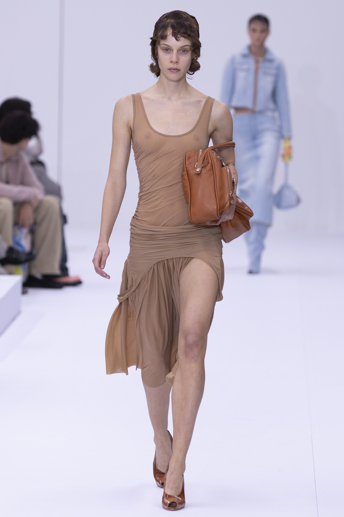 epa11624923 A model presents a creation from the Womenswear Spring/Summer 2025 collection of Acne Studios during the Paris Fashion Week, in Paris, France, 25 September 2024. The presentation of the Wo ...