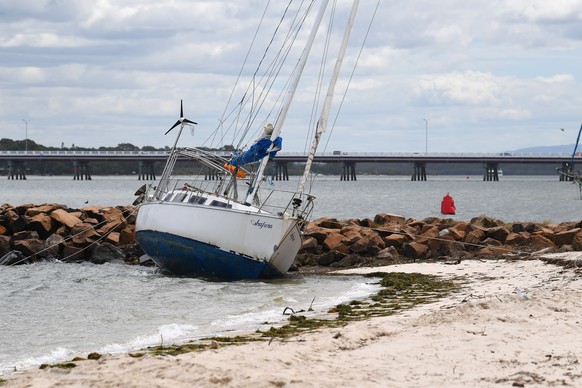 epa11938976 A boat is seen beached after it was blown from its mooring on Bribie Island, Brisbane, Australia, 04 March 2025. Residents are advised to prepare for the incoming tropical Cyclone Alfred w ...