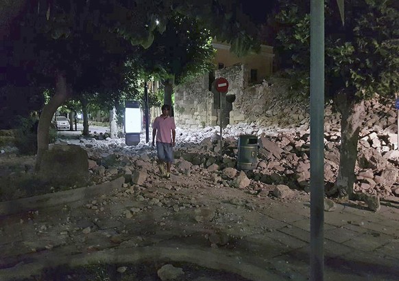 A man walks near a damaged building after an earthquake on the Greek island of Kos early Friday, July 21, 2017. A powerful earthquake struck Greek islands and Turkey&#039;s Aegean coast early Friday m ...