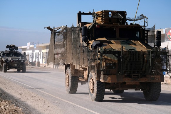 epa07252705 Turkish forces and Members of the Turkish-backed Free Syrian Army move some 10km away from Manbij town in northern Syria, 29 December 2018. According to reports on 28 December 2018, The US ...