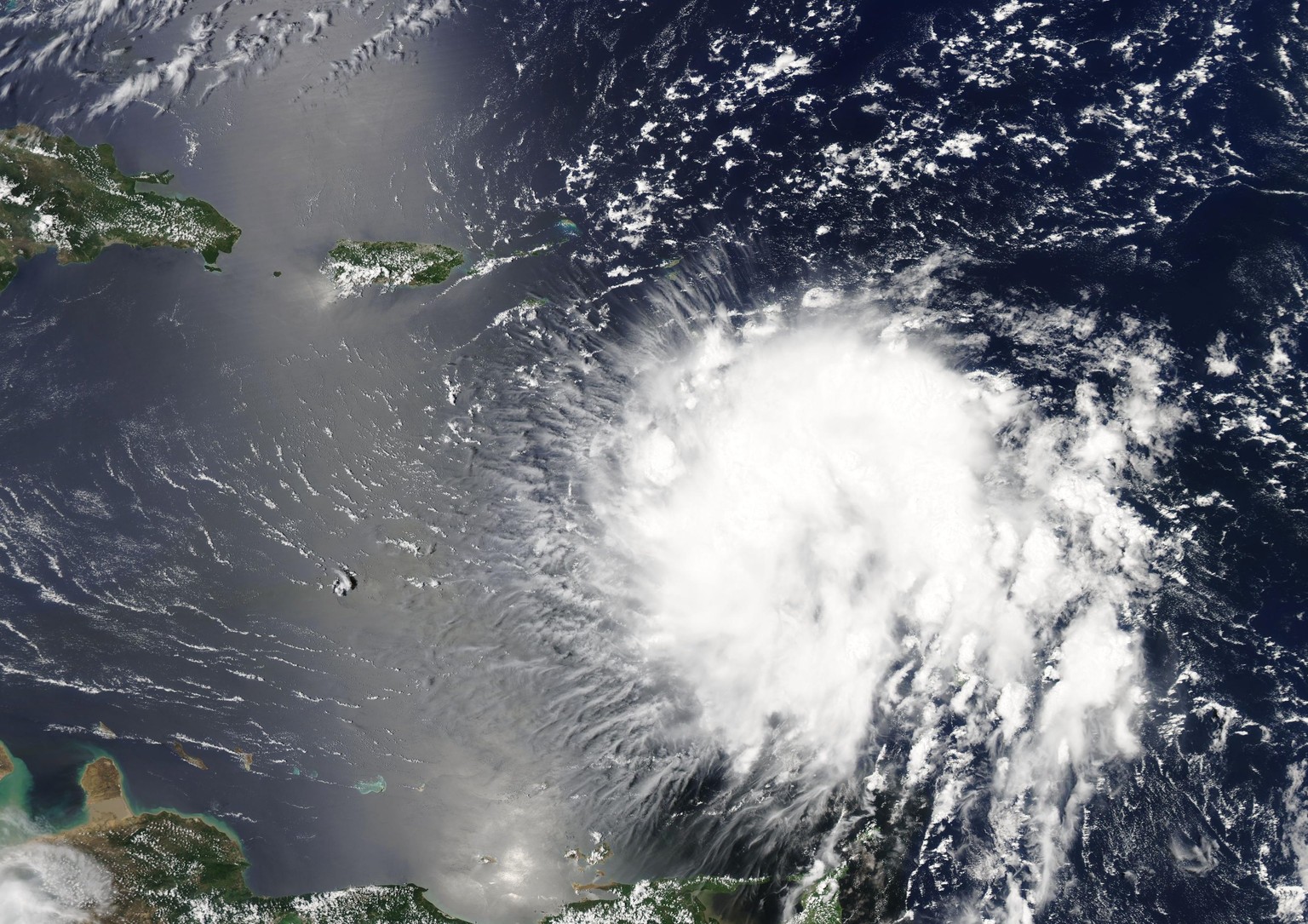 epa07798528 A handout photo made available by NASA shows a visible image acquired from the MODIS instrument aboard NASA&#039;s Terra Satellite of Tropical Storm Dorian as it approaches the east coast  ...