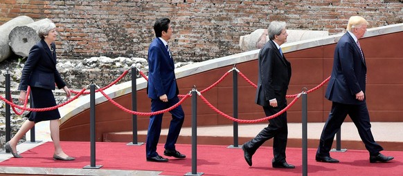 epa05991402 (L-R): British Prime Minister Theresa May, Japanese Prime Minister Shinzo Abe, Italian Prime Minister Paolo Gentiloni and US President Donald J. Trump arrive for the group photocall on the ...