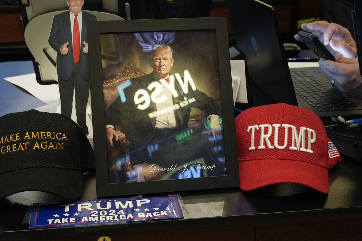 Paraphernalia supporting President Donald Trump is displayed at a post on the floor of the New York Stock Exchange in New York, Tuesday, Jan. 21, 2025. (AP Photo/Seth Wenig)