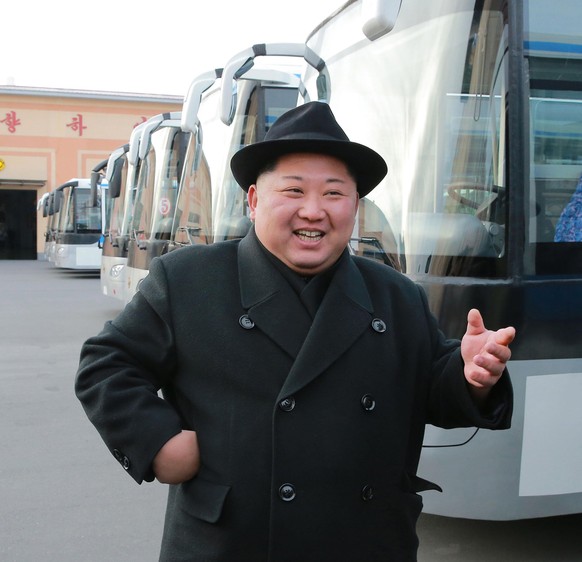 epa06489552 North Korean leader Kim Jong Un tours a Pyongyang trolley bus factory, 01 February 2018. Youth league officials from across the country begin their study tour of leader Kim Jong Il&#039;s  ...