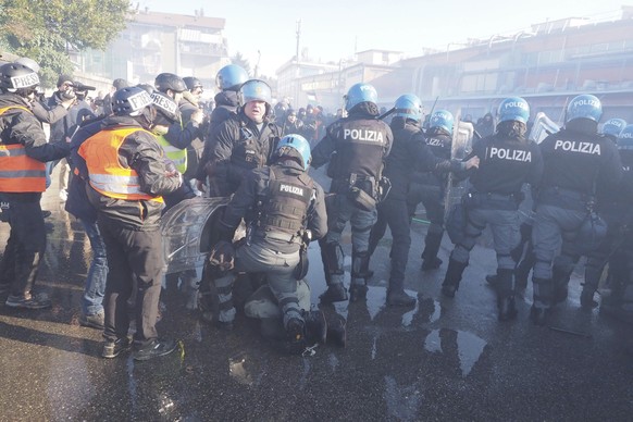 Anti-Israel protesters clash with police in the northern Italian city of Vicenza on Saturday, Jan. 20, 2024, after they attempted to enter the trade fair grounds to protest the presence of an Israeli  ...