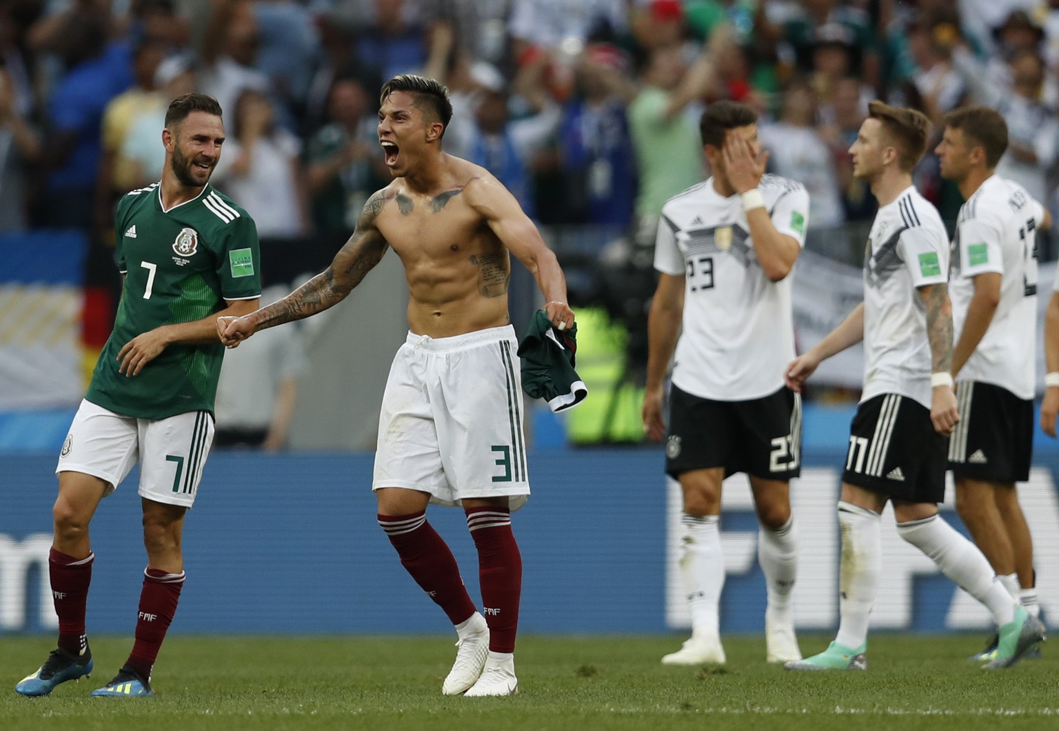 Mexico&#039;s Carlos Salcedo, second left, and Miguel Layun, left, react after Mexico defeated Germany in their group F match at the 2018 soccer World Cup in the Luzhniki Stadium in Moscow, Russia, Su ...