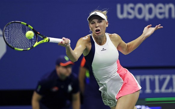 Caroline Wozniacki, of Denmark, returns to Anastasija Sevastova, of Latvia, during the women&#039;s singles quarterfinal round at the U.S. Open tennis tournament, Tuesday, Sept. 6, 2016, in New York.  ...