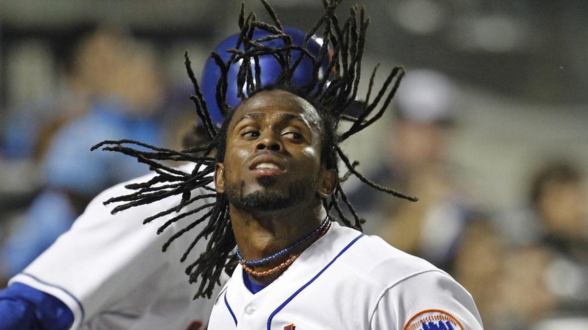 New York Mets Jose Reyes (7) celebrates with on-deck batter Ike Davis after scoring on David Wright's third-inning sacrifice fly in their baseball game against the Colorado Rockies at Citi Field  ...