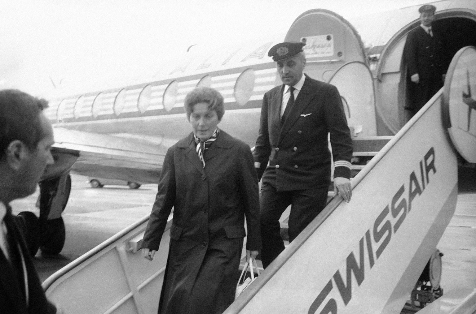 Svetlana Stalina, 42, walks down ramp of plane that brought her to Geneva, Switzerland on March 11, 1967. She was the sole passenger aboard a special flight of the Italian state-owned Alitalia Airline ...