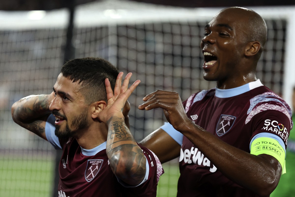 West Ham's Manuel Lanzini celebrates with West Ham's Angelo Ogbonna, right, after scoring his sides first goal during the Europa Conference League Group B soccer match between West Ham Unite ...