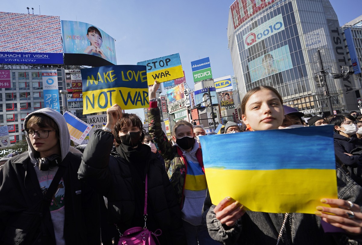epa09786238 People hold placards during a protest against Russia's invasion of Ukraine, in Tokyo, Japan, 26 February 2022. Russian troops entered Ukraine on 24 February prompting the country' ...
