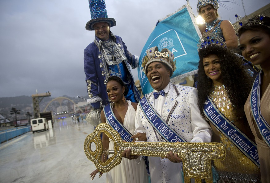 Carnival King Momo Wilson Neto, center holds the key to the city at a ceremony marking the official start of Carnival at the Sambadrome, in Rio de Janeiro, Brazil, Friday, March 1, 2019. Marcelo Crive ...