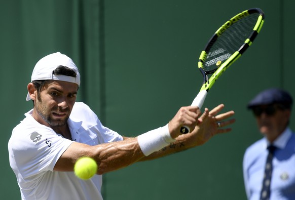 epa06067479 Simone Bolelli of Italy in action against Jo-Wilfried Tsonga of France during their second round match for the Wimbledon Championships at the All England Lawn Tennis Club, in London, Brita ...