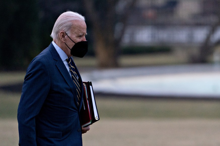 epa10400665 US President Joe Biden walks on the South Lawn of the White House following an arrival on Marine One after accompanying First Lady Jill Biden to Walter Reed National Military Medical Cente ...