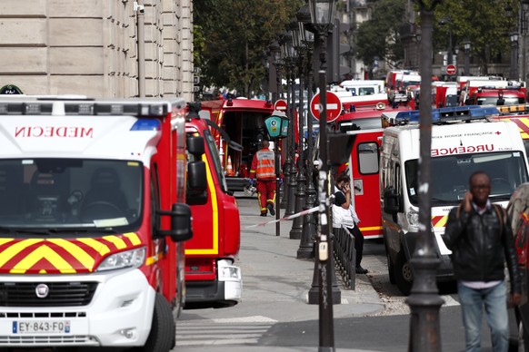 epa07891581 French police and security forces establish a security perimeter near the police headquarters in Paris, France, 03 October 2019. According to reports, a man was killed after attacking offi ...