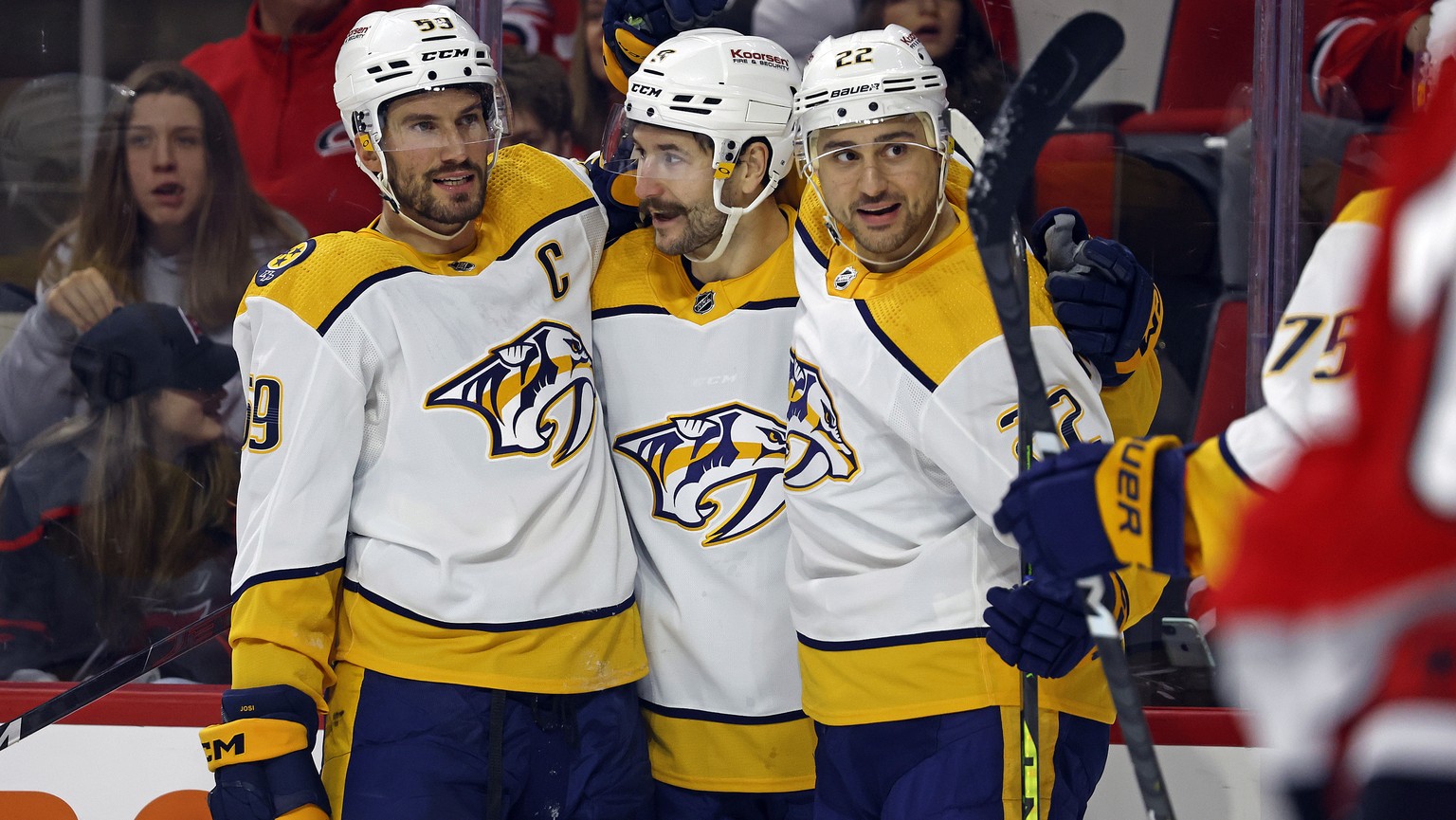 Nashville Predators&#039; Filip Forsberg, center, celebrates after his goal with teammates Roman Josi (59) and Nino Niederreiter (22) during the first period of an NHL hockey game against the Carolina ...