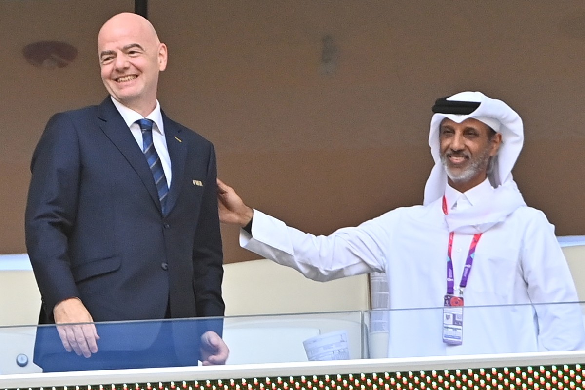 epa10327372 FIFA president Gianni Infantino (L) attends the FIFA World Cup 2022 group A soccer match between Qatar and Senegal at Al Thumama Stadium in Doha, Qatar, 25 November 2022. EPA/Noushad Thekk ...