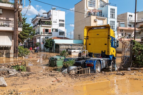 epaselect epa10848364 A truck is seen amidst debris on a muddy road in the coastal port city of Volos, in Magnesia regional unit, Thessaly region, after storm &#039;Daniel&#039; swept across central G ...