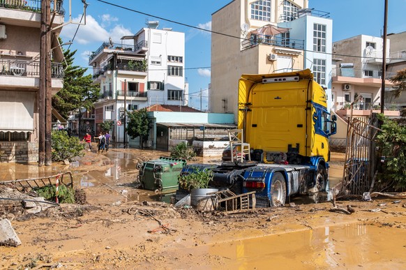 epaselect epa10848364 A truck is seen amid debris on a muddy road in the coastal port city of Volos, in the Magnesia regional unit, region of Thessaly, after storm 'Daniel' swept over central G...