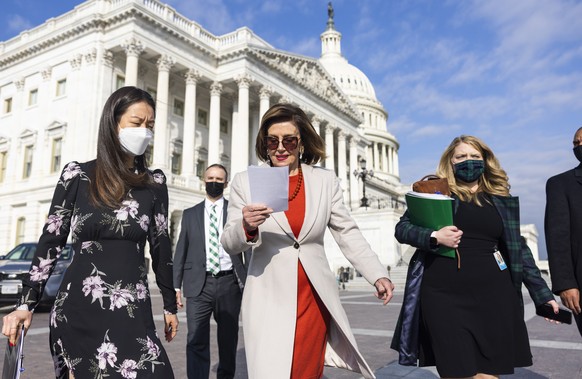 epa09587539 Speaker of the House Nancy Pelosi (C) prepares to speak on the Build Back Better Bill outside the US Capitol in Washington, DC, USA, 17 November 2021. Pelosi says she hopes to vote on the  ...