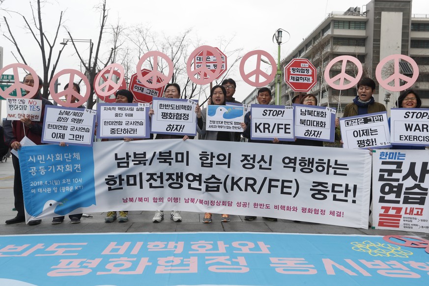 epa06639859 South Korean protesters shout slogans as they hold a banner reading &#039;Stop War Ecercises&#039; during a rally against South Korea and US military forces joint &#039;Key-Resolve / Foal  ...
