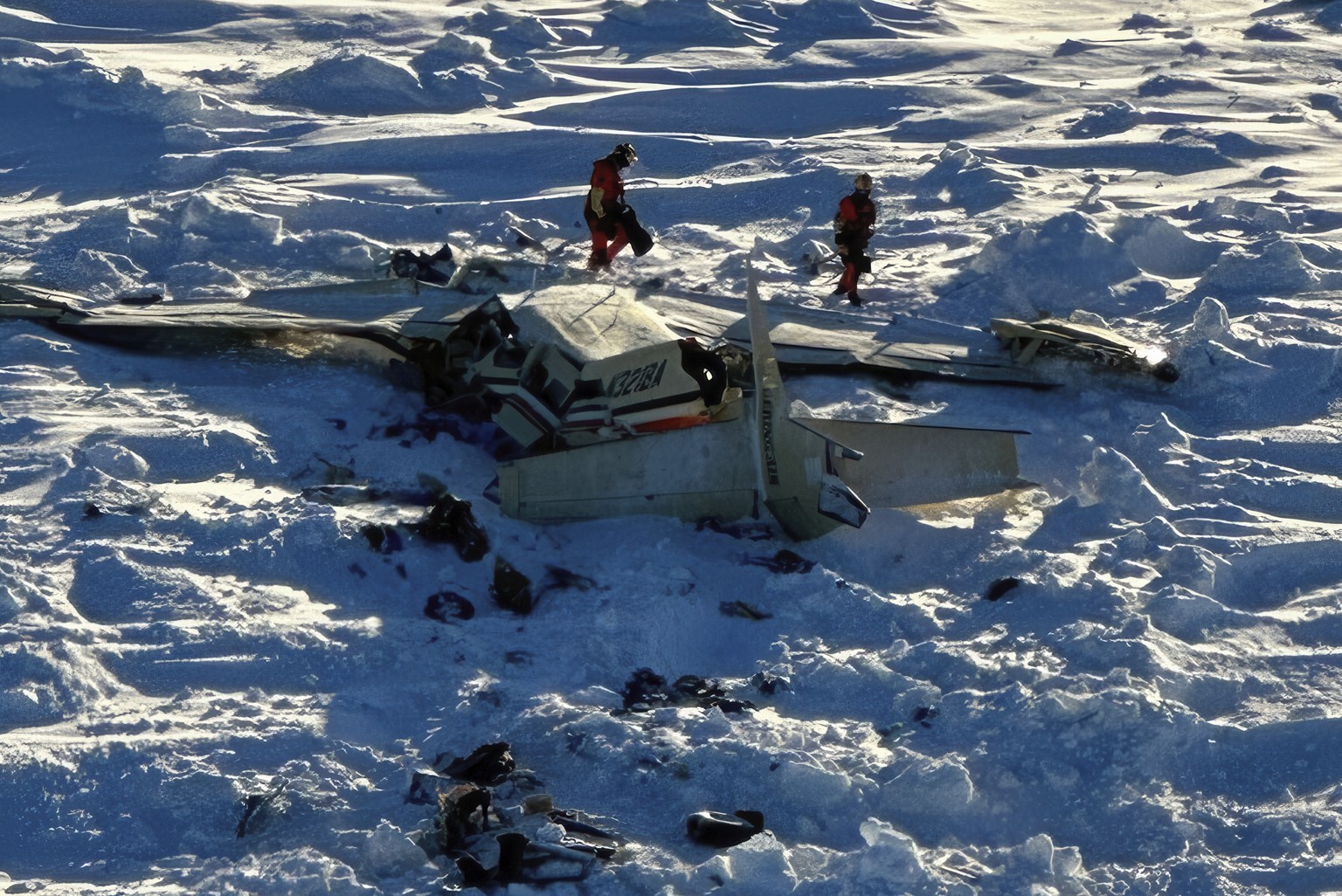 This photo provided by the U.S. Coast Guard on Friday, Feb. 7, 2025, shows a small commuter plane that crashed in western Alaska on a flight that was bound for the hub community of Nome. (U.S. Coast G ...