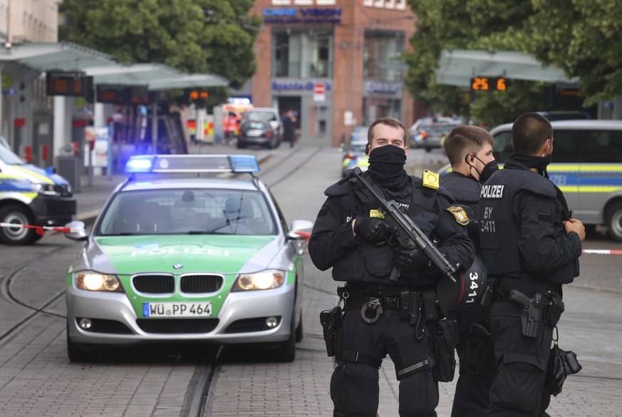 Police are positioned at the scene of an incident in Wuerzburg, Germany, Friday June 25, 2021. German police say several people have been killed and others injured in a knife attack in the southern ci ...
