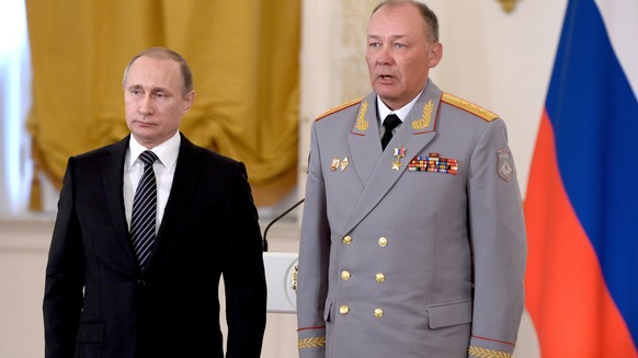 In this photo taken on March 17, 2016, Russian President Vladimir Putin, left, poses with Col. Gen. Alexander Dvornikov during an awarding ceremony in Moscow's Kremlin, Russia. Russia has appointed a  ...