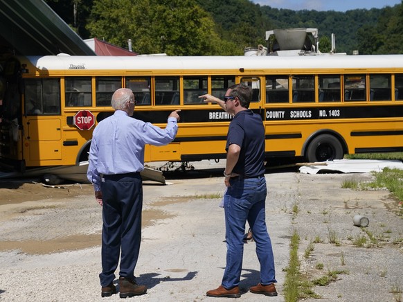 President Joe Biden and Kentucky Gov. Andy Beshear, view flood damage, Monday, Aug. 8, 2022, in Lost Creek, Ky., where a bus floated into a building. (AP Photo/Evan Vucci)
Joe Biden