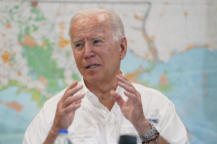 President Joe Biden participates in a briefing about the response to damage caused by Hurricane Ida, at the St. John Parish Emergency Operations Center, Friday, Sept. 3, 2021, in LaPlace, La. (AP Phot ...