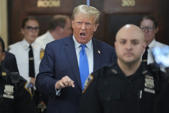 Former President Donald Trump speaks to reporters during a lunch break at New York Supreme Court in New York, Monday, Oct. 2, 2023. Trump is attending the start of a civil trial in a lawsuit that alre ...
