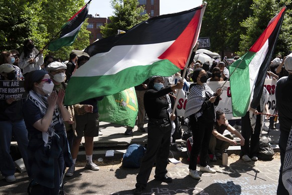George Washington University students demonstrate on the street after police close the student plaza during a pro-Palestinian protest over the Israel-Hamas war on Friday, April 26, 2024, in Washington ...