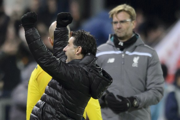 Liverpool&#039;s manager Juergen Klopp, right, looks desapointed as Sion&#039;s head coach Didier Tholot, left, celebrates after the UEFA Europa League group B soccer match between FC Sion and FC Live ...