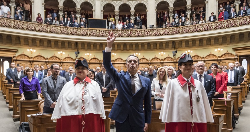 epa06215263 Newly elected Federal Councilor Ignazio Cassis (C) waves infont of the 117 members of the United National Assembly, in the National Council in Berne, Switzerland, 20 September 2017. EPA/PE ...