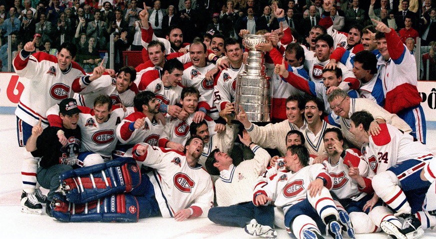 FILE - The Montreal Canadiens pose for a photograph with the Stanley Cup following their 4-1 victory over the Los Angeles Kings in Montreal, in this June 9, 1993, file photo. Patrick Roy is at front l ...