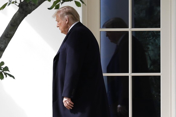 United States President Donald J. Trump walks from the Oval Office of the White House in Washington before his departure for a roundtable with supporters in Bedminster, New Jersey on October 1, 2020.  ...