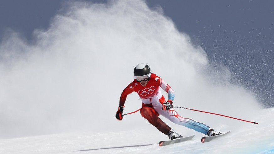 Michelle Gisin of Switzerland makes a turn during the women&#039;s combined downhill at the 2022 Winter Olympics, Thursday, Feb. 17, 2022, in the Yanqing district of Beijing. (AP Photo/Alessandro Trov ...