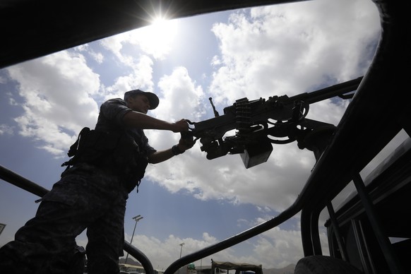 epa11212138 A Houthi soldier mans a machine gun on a vehicle while on patrol in Sana&#039;a, Yemen, 10 March 2024. Yemen&#039;s Houthis will continue launching more missile and drone attacks at shippi ...