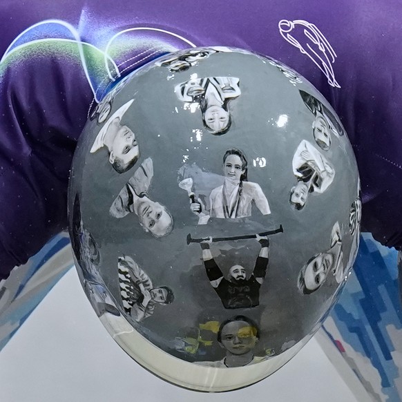 Ukraine's Vladyslav Heraskevych arrives at the finish during a men's skeleton training session at the 2026 Winter Olympics, in Cortina d'Ampezzo, Italy, Tuesday, Feb. 10, 2026. (AP Phot ...