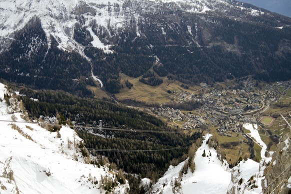 epa10381469 The alpine ski resort of Leukerbad is pictured from the Gemmi Pass, in Leukerbad, Switzerland, 29 December 2022. The mild weather of the last few days in the Swiss Alps has disrupted the a ...