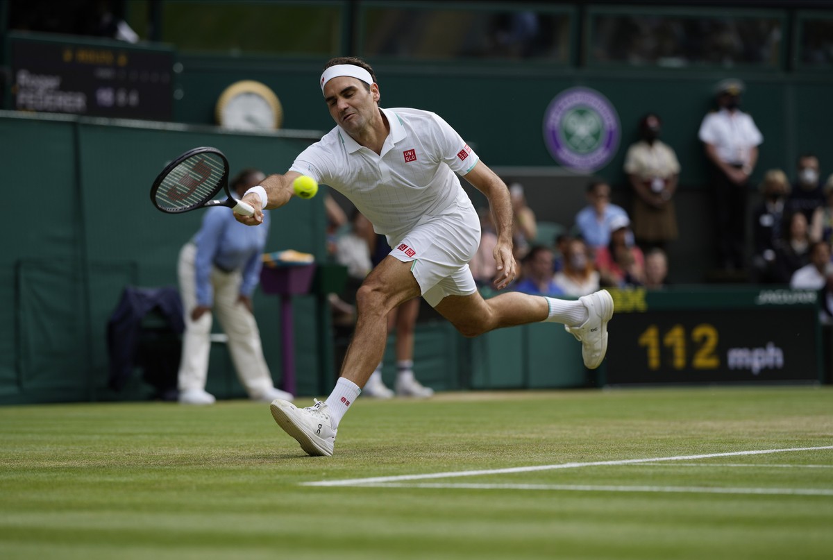 FILE - Switzerland's Roger Federer plays a return to Britain's Cameron Norrie during the men's singles third round match on day six of the Wimbledon Tennis Championships in London, Satu ...
