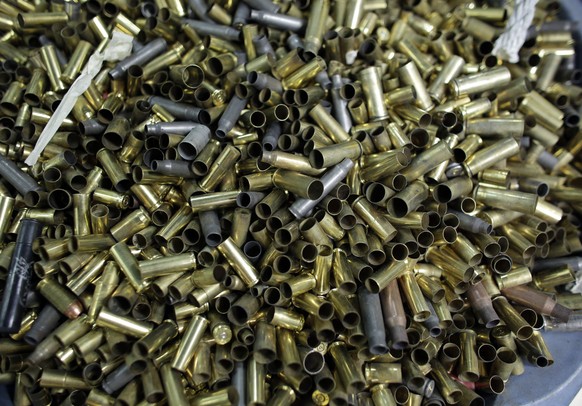 FILE - In this Jan. 5, 2016 file photo, empty bullet casings sit in a container at the National Armory gun store and gun range in Pompano Beach, Fla. A U.S. appeals court has upheld a California law t ...