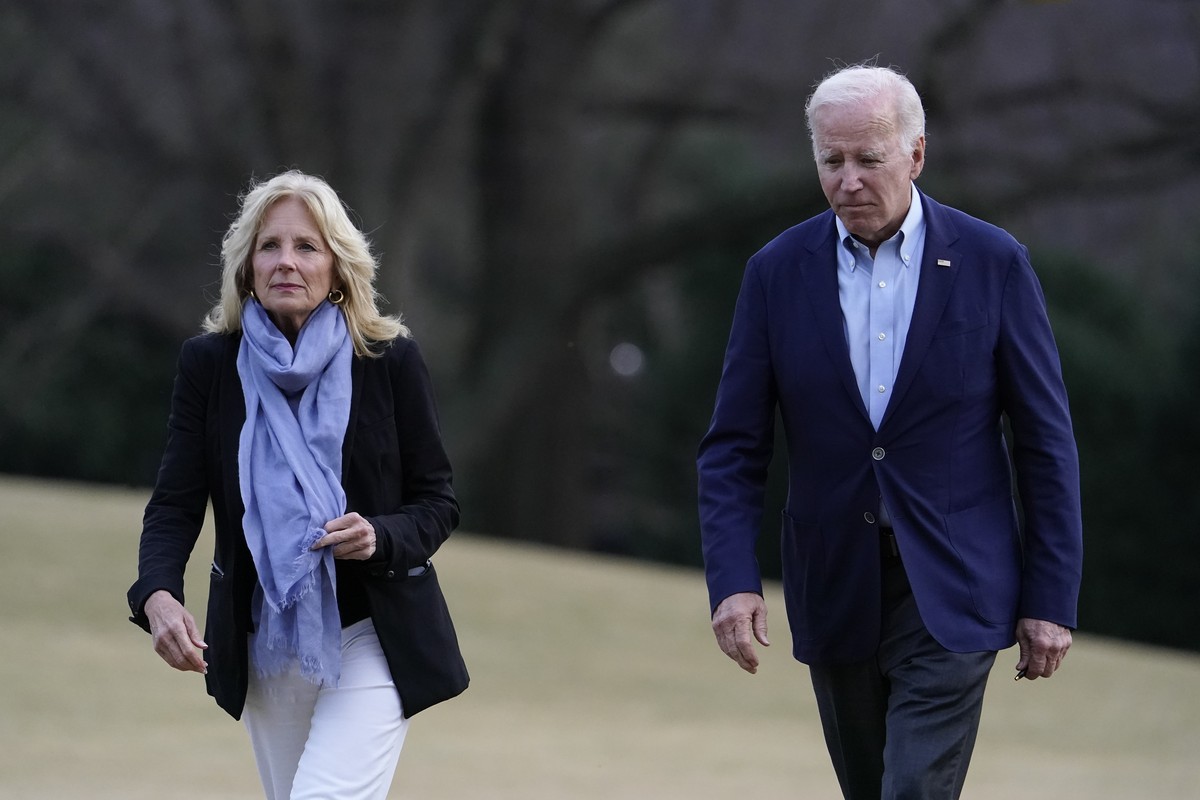 President Joe Biden and first lady Jill Biden walk on the South Lawn of the White House after stepping off Marine One, Monday, Jan. 2, 2023, in Washington. The Bidens are returning to Washington after ...