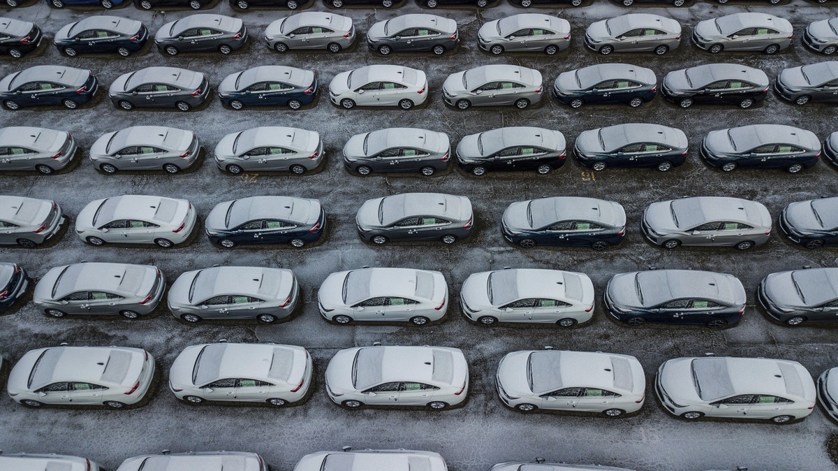 FILE - In this Dec. 5, 2018 file photo, hundreds of Chevrolet Cruze cars sit in a parking lot at General Motors' assembly plant in Lordstown, Ohio. The long-struggling Rust Belt community of Youn ...