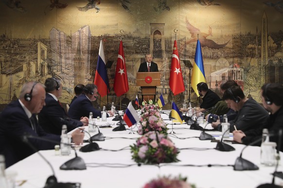 FILE - In this photo provided by Turkish Presidency, Turkish President Recep Tayyip Erdogan, center, gives a speech to welcome the Russian, left, and Ukrainian delegations ahead of their talks, in Ist ...