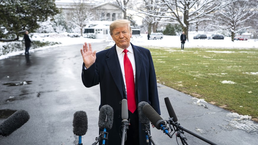 epa07283432 US President Donald J. Trump speaks about the Russia investigation and the partial government shutdown as he departs the White House to speak to a Farm Convention in New Orleans, in Washin ...